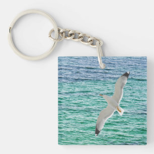 Möwe fliegt über ein Meer Schlüsselanhänger