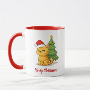 Mürrische orange getigerte Katze mit roter Weihnac Tasse