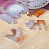 Muscheln im Puzzle am Strand (Seite)