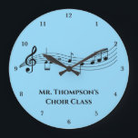 Musical Notes Band Teacher Custom Music Class Große Wanduhr<br><div class="desc">A cool custom music class wall clock featuring a musical staff with notes on a blue background. Order for a musician,  composer,  band or orchestra conductor,  or choir director and personalize with a music department name or other text.</div>