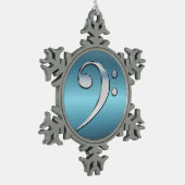 Musik-Bassschlüssel auf metallischer Schneeflocken Zinn-Ornament (Links)