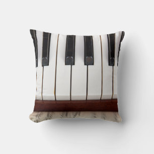 musikalische Noten auf dem Hintergrund eines piano Kissen