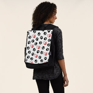 Muster aus Pfoten, schwarzen Pfoten, roten Pfoten, Rucksack