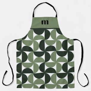 Muster der grünen Monogrammkarte Schürze