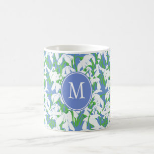 Muster-Monogramm für Snowdrop auf blauem Hintergru Kaffeetasse