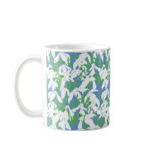 Muster-Monogramm für Snowdrop auf blauem Hintergru