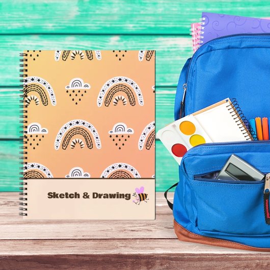 Muster Rainbows auf gelben Notebooks Notizblock