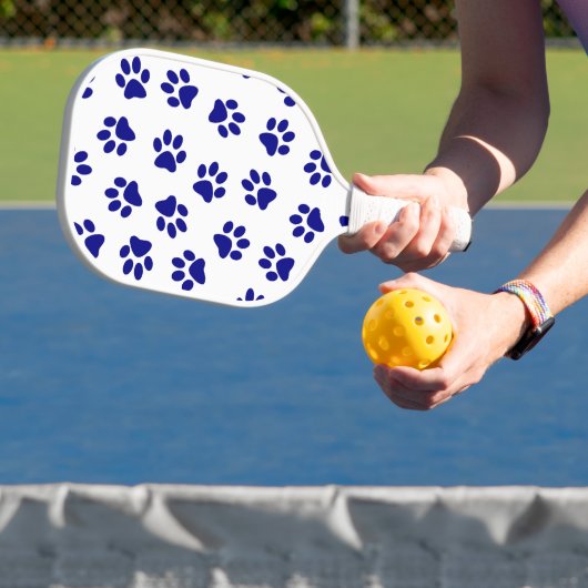 Muster von Pfoten, Hundeschäften, blaue Navy-Paws Pickleball Schläger (InSitu)