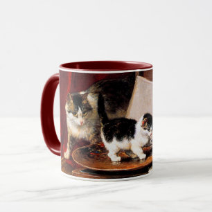 Mutterkatze und Kätzchen am Tisch Tasse