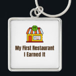 My First Restaurant Keychain – I Earned It – Proud Schlüsselanhänger<br><div class="desc">Celebrate the pride of opening your very first restaurant! This keychain features the bold phrase "My First Restaurant – I Earned It", perfect for anyone who worked hard to achieve this milestone. Whether it’s a diner, café, or full-service restaurant, this keychain is a fun and meaningful reminder of dedication and...</div>