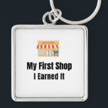 My First Shop Keychain – I Earned It – Proud First Schlüsselanhänger<br><div class="desc">Celebrate the pride of opening your very first shop! This keychain features the bold phrase "My First Shop – I Earned It", perfect for anyone who worked hard to achieve this milestone. Whether it’s a boutique, online store, or local business, this keychain is a fun and meaningful reminder of dedication...</div>