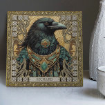Mystical Raven Spirit Personalisiert Tribal Fliese<br><div class="desc">Begeben Sie sich auf eine mystische Reise mit unserer Keramik "Mystical Raven Spirit". Das Design besticht durch einen majestätischen Raven, prachtvoll mit Stammestühlen, in perfekter symmetrischer Harmonie eingefangen. Die Farbtöne sind reich und gemütlich, mit dunkelgrünen, braunen, goldenen und dunklen Aquamarinen, die ein Gefühl schaffen, das an ein altartiges Stück erinnert....</div>