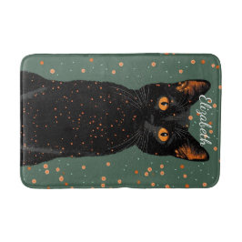 Mystische schwarze Katze mit orangefarbenen Augen Badematte