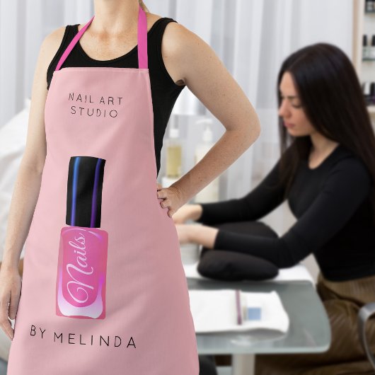 Nagellalonmanikurist, modern pinkfarben schürze