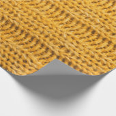 Nah aus gelbem gestricktem Hintergrund. Tr Geschenkpapier (Ecke)
