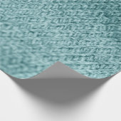 Nah aus grün gestricktem Hintergrund. Geschenkpapier (Ecke)