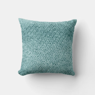 Nah aus grün gestricktem Hintergrund. Kissen