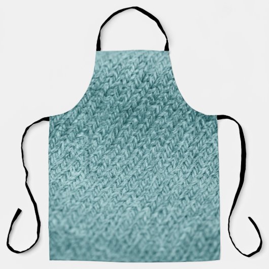 Nah aus grün gestricktem Hintergrund.  Schürze (Vorderseite)