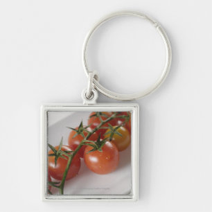 Nahaufnahme der Tomaten auf einem Behälter Schlüsselanhänger