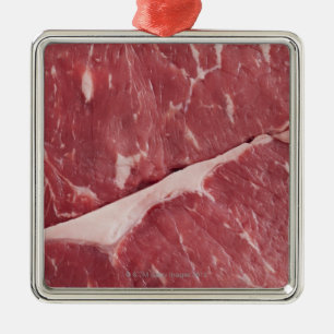 Nahaufnahme des rohen Steaks Silbernes Ornament