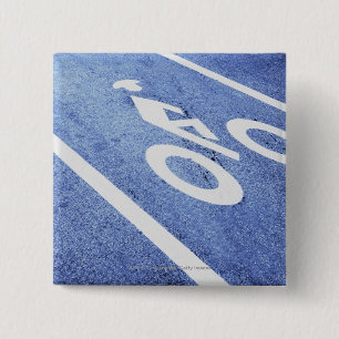 Nahaufnahme eines Fahrradzeichens auf der Straße Button