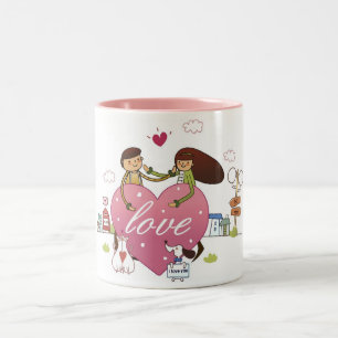 Nahaufnahme eines Paares, das ein Herz hält, Zweifarbige Tasse