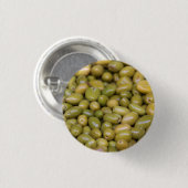 Nahes Aufsetzen grüner Oliven Button (Vorne & Hinten)