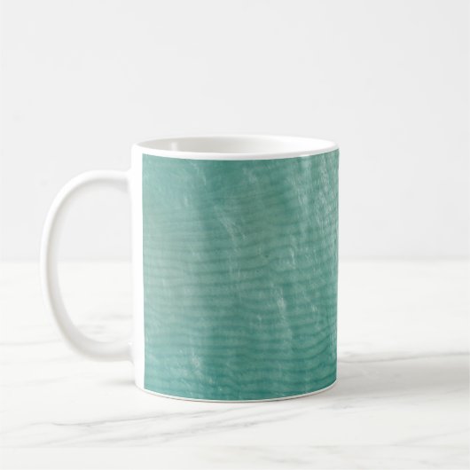 Nahes Foto aus grünem Stoff Kaffeetasse (Links)