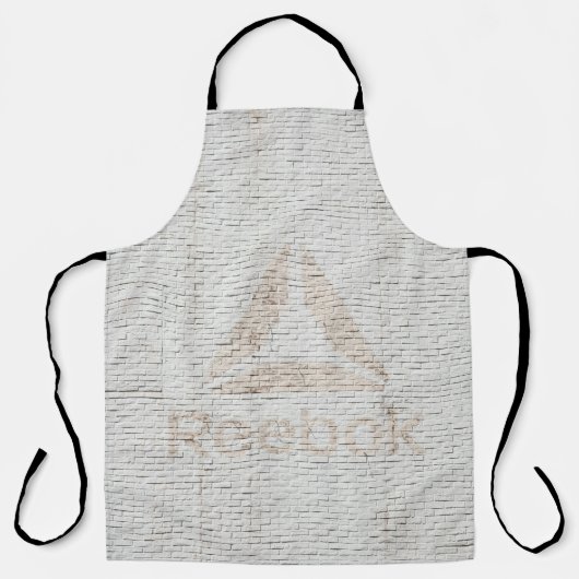 Nahes Foto des Reebok-Logos an der Wand Schürze (Vorderseite)