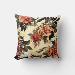 Nahtlose Blumenmuster mit roten und orangefarbenen Kissen