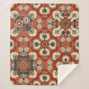 Nahtlose Ziermuster mit Blumen und Paiseln Sherpadecke