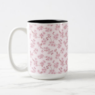 Nahtloses Blumenmuster mit rosa Kirschblüten Zweifarbige Tasse