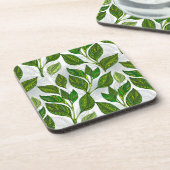 Nahtloses Muster mit Blätter aus grünem Tee Getränkeuntersetzer (Linke Seite)