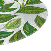 Nahtloses Muster mit Blätter aus grünem Tee Schneidebrett (Ecke)