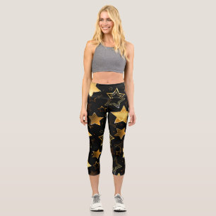 Nahtloses Muster mit goldenen Sternen Capri Leggings