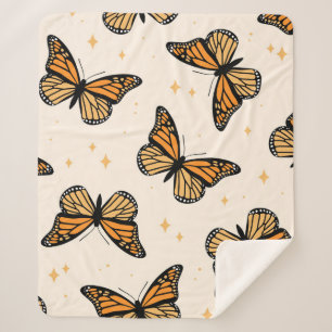 Nahtloses Muster mit monarchischen Schmetterlingen Sherpadecke