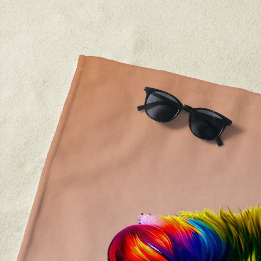 Namenstext hinzufügen, farbiger Paint-Tropfen auf  Strandtuch (Beispiel)