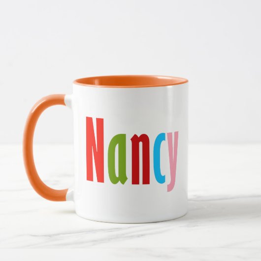 "Nancy" Name in lebendiger Spaß und farbenfroher S Tasse (Links)