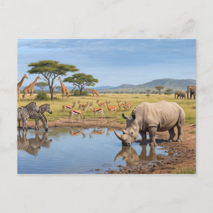 Nashorn beim Trinken am Wasserloch in der Savanne Postkarte