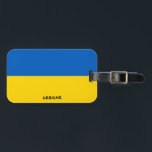 Nationalflagge Patriotic Gepäckanhänger<br><div class="desc">Die Ukraine National Flag Patriotic Gepäckmarke mit der ukrainischen Flagge auf der einen Seite des Tags gedruckt. Der mit dem lebendigen Schriftart geschriebene Ländername ist in das Design am unteren Rand integriert. Der Text kann mit der Funktion "Anpassen!" vollständig angepasst werden. Die andere Seite des Tags ist für Ihre Informationen...</div>