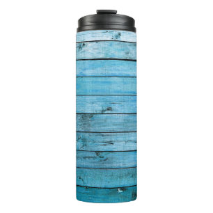 Natürliches blaues Holz, texturierter Hintergrund. Thermosbecher