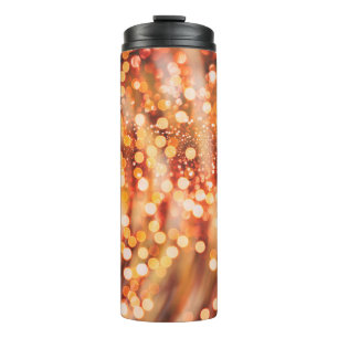 Natürliches Bukett und helle goldene Lichter Thermosbecher
