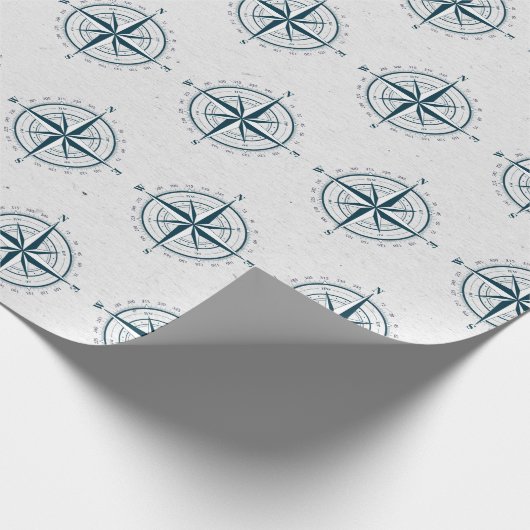 Nautischer Kompass auf texturiertem Grau Geschenkpapier (Ecke)