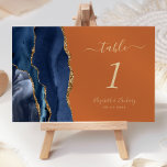 Navy Blue Gold Agate Burnt Orange Wedding<br><div class="desc">Der links Rand dieser eleganten,  modernen Hochzeitskarte weist eine marineblau-blaue Aquarellgrenze mit vergoldetem Imitat-Glitzer auf. Der anpassbare Text kombiniert goldfarbene Handschrift,  kursiv und kopperplate Schriftart auf einem verbrannten orangen Hintergrund.</div>
