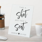 Nehmen Sie einen Schuss und nehmen Sie das Plakats Sockelschild (In SItu)