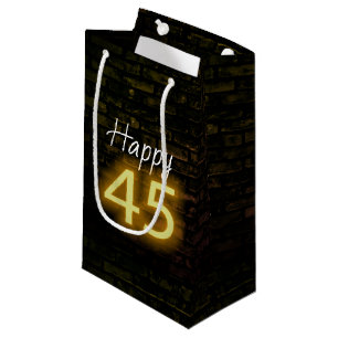 Neon-Geburtstagsschild 45 auf Ziegelstein  Kleine Geschenktüte