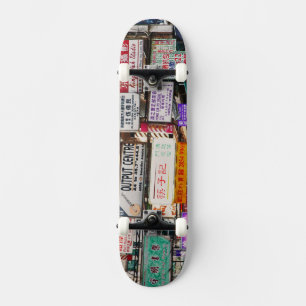 Neon signs in the streets of Hong Kong Skateboard