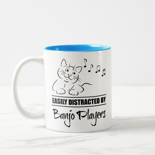 Neugierige Katze, leicht von Banjo-Spielern abgele Zweifarbige Tasse (Links)