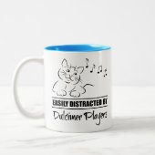 Neugierige Katze, leicht von Dulcimer-Spielern abg Zweifarbige Tasse (Links)