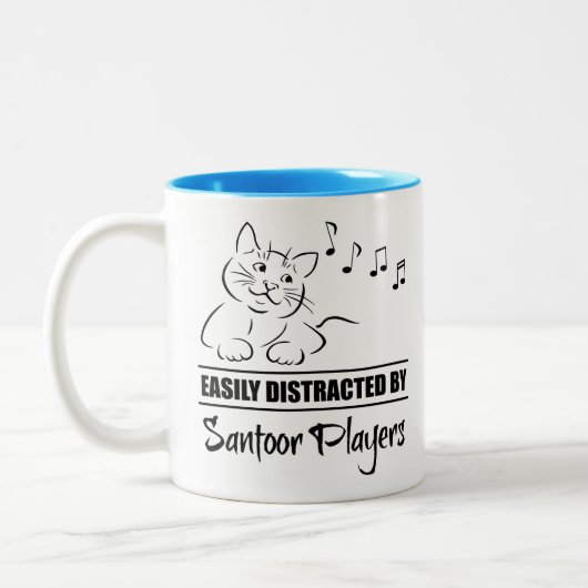 Neugierige Katze, leicht von Santoor-Spielern abge Zweifarbige Tasse (Links)